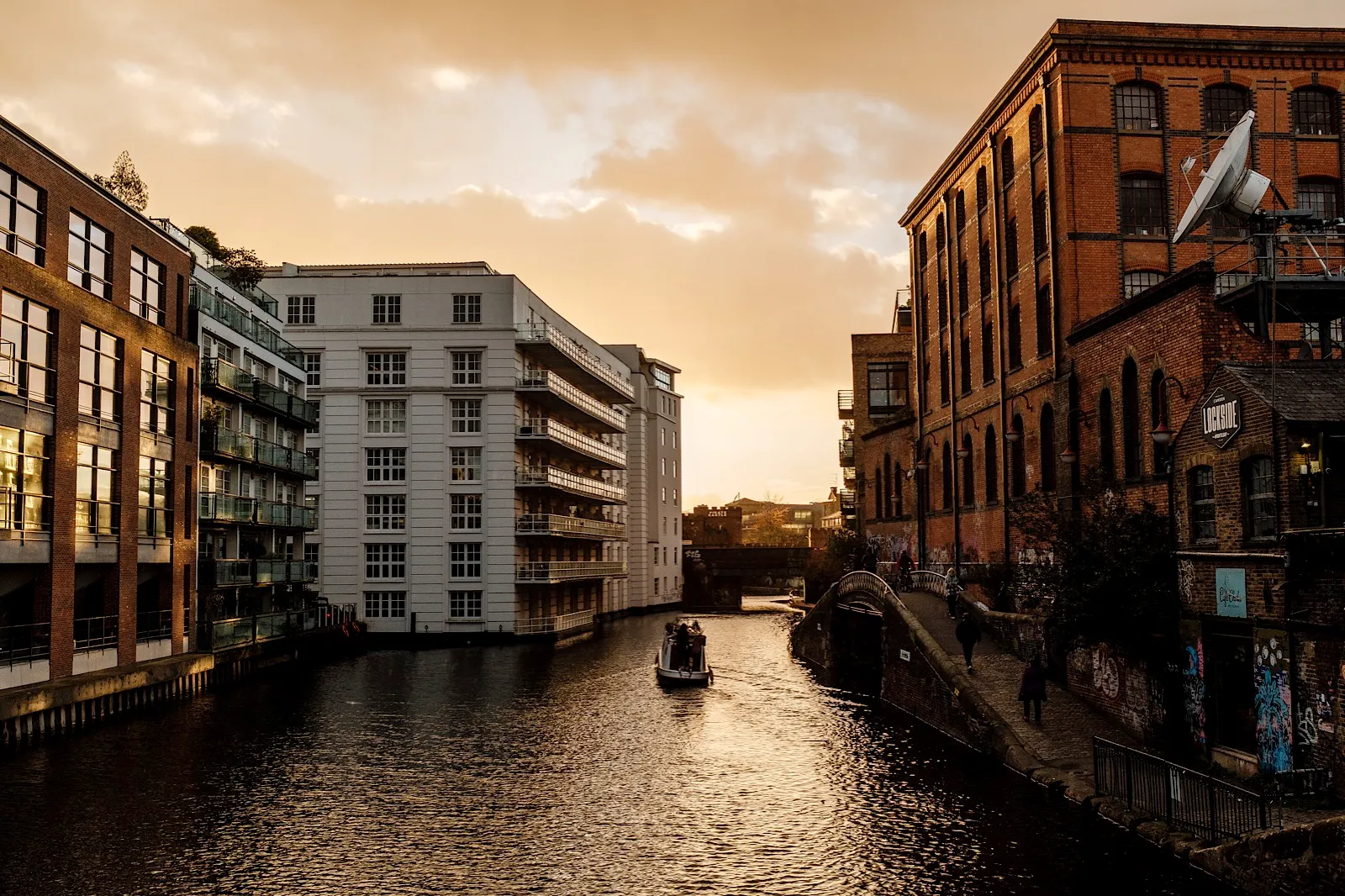 View of buildings in canal lockside sunset scene in London