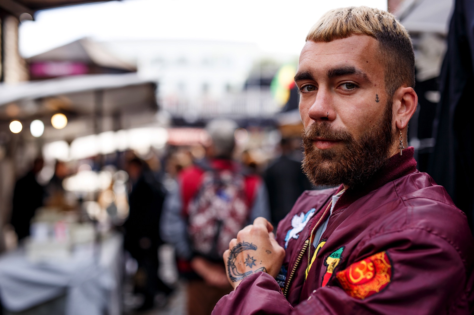 Street portrait of man with piercings and tattoos