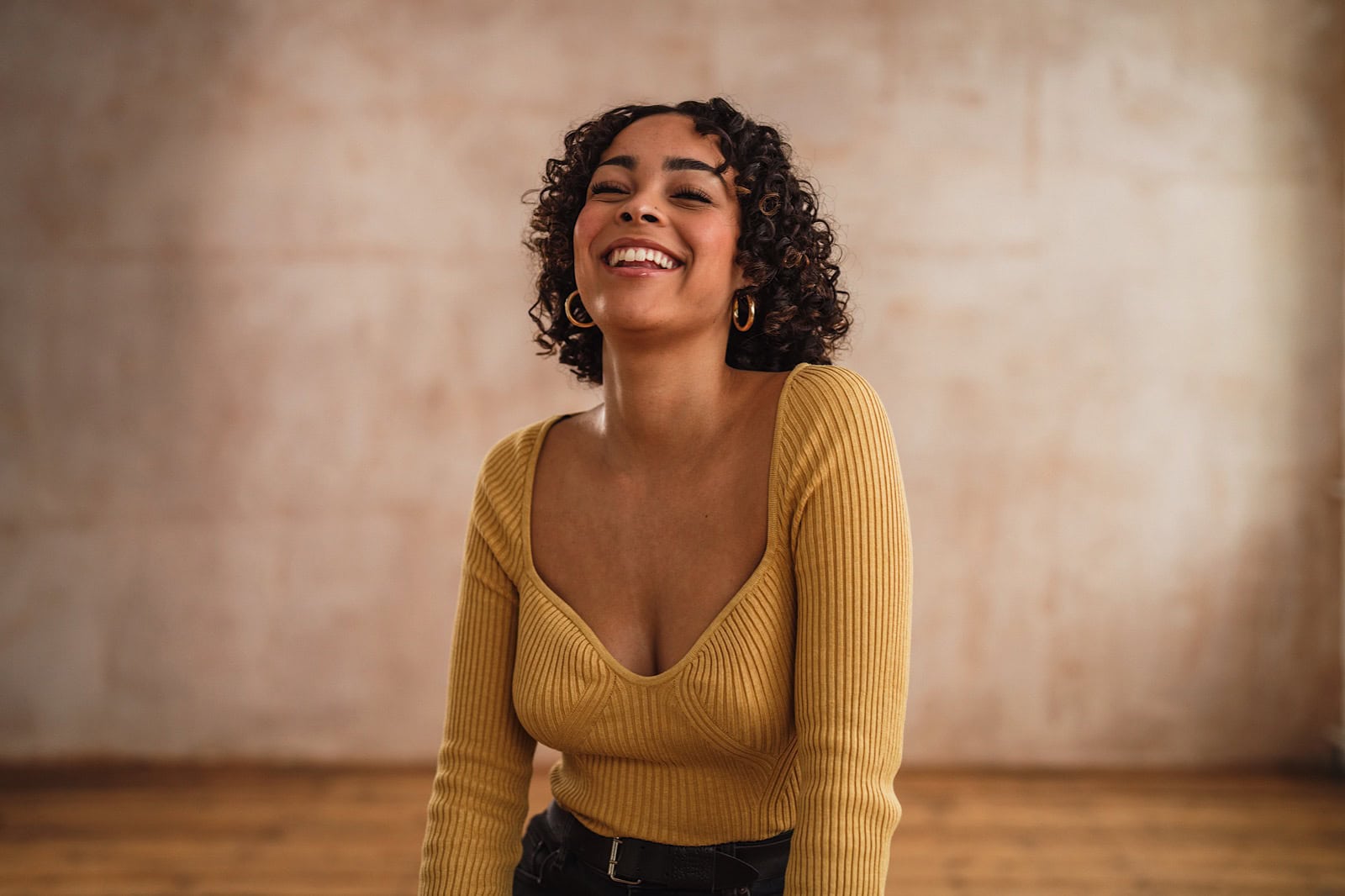 Woman laughing during a commercial portrait shoot
